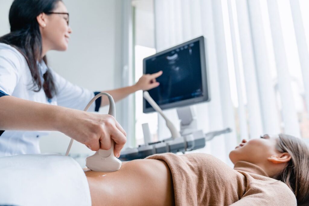 doctor patient looking at ultrasound