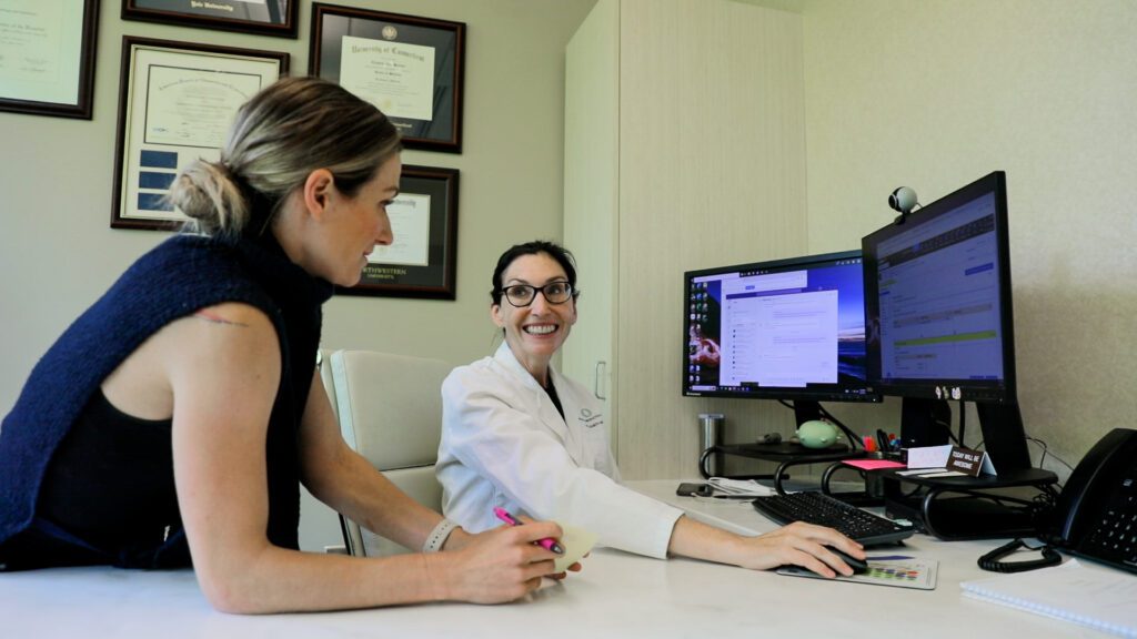 Dr. Barbieri and Dr. Kutz at desk 4
