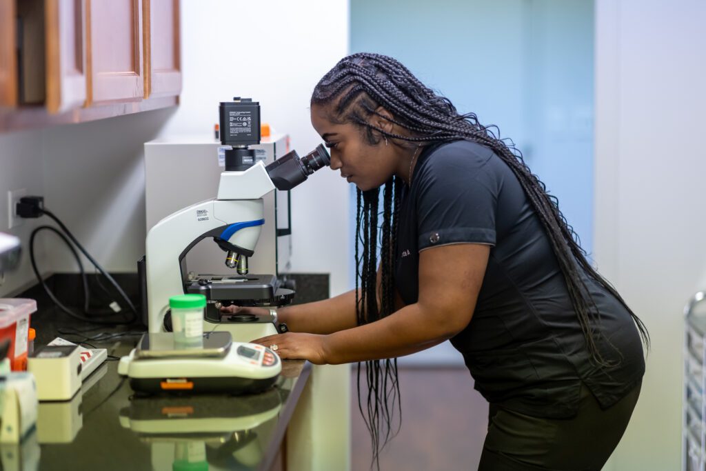 Nurse using microscope 1
