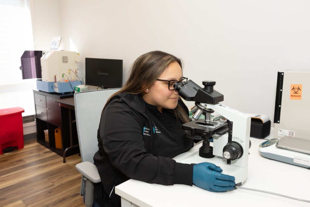 Nurse using microscope 1-oakbrook