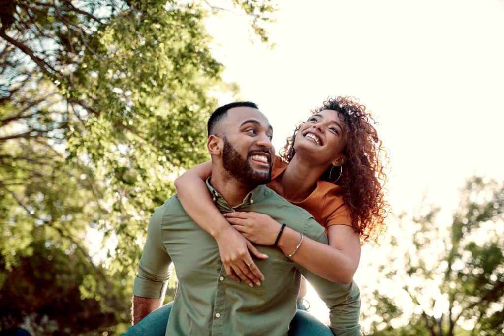 happy looking couple enjoying time together out in nature