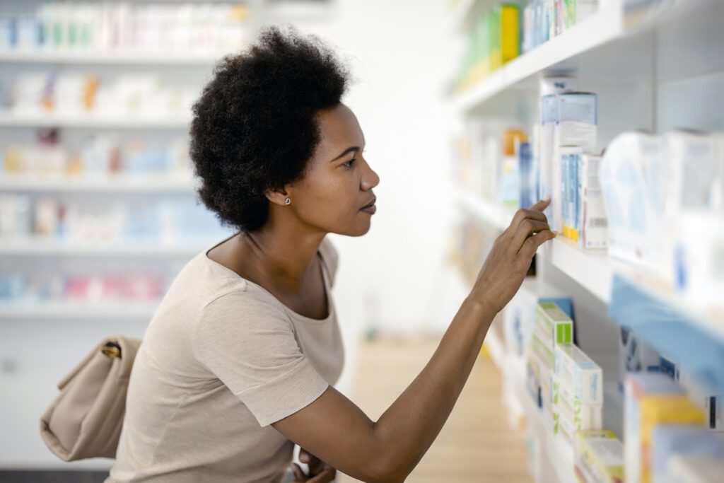 woman looking at CoQ10 supplements for fertility