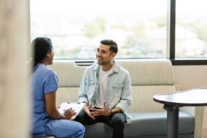 photo of a male patient talking with a doctor