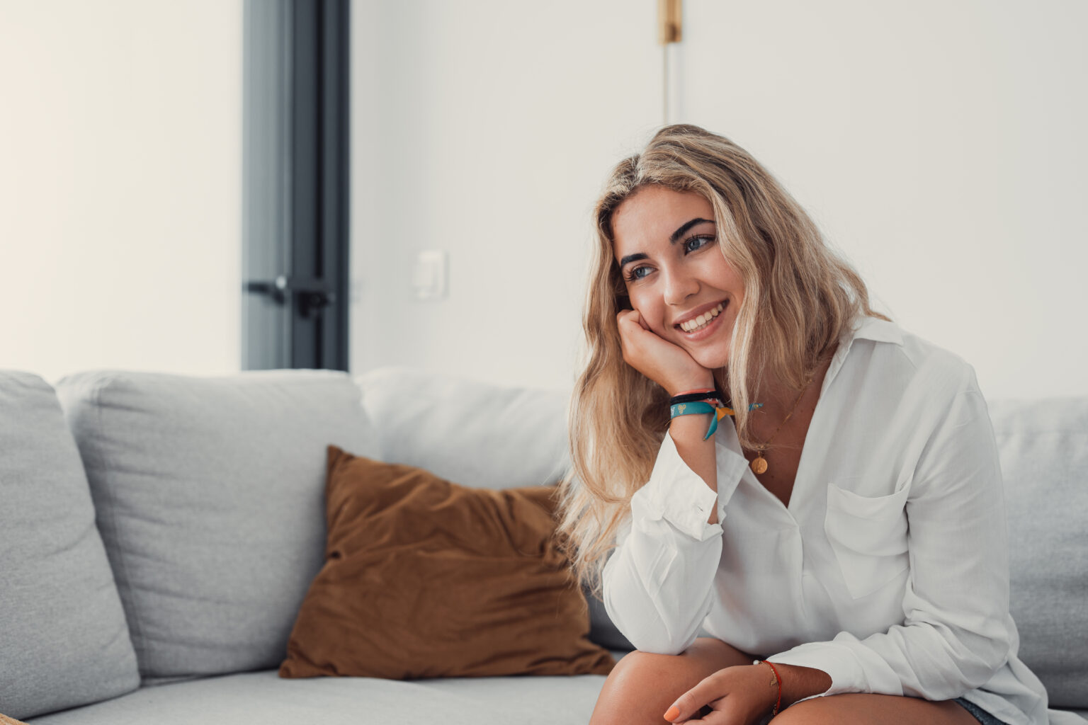 Happy young woman look in distance feeling positive and optimistic.