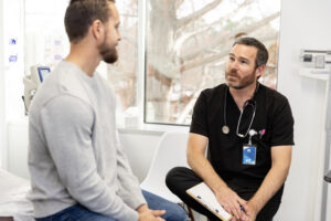 After exam, male doctor gives young man advice