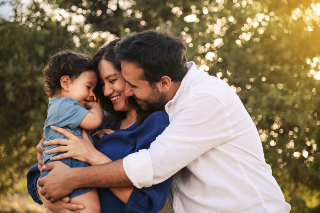 Happy Family Embracing in Nature