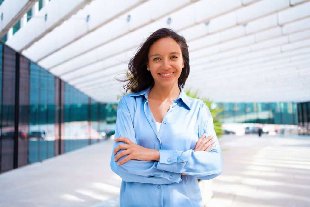 confidence businesswoman portrait with crossed hands