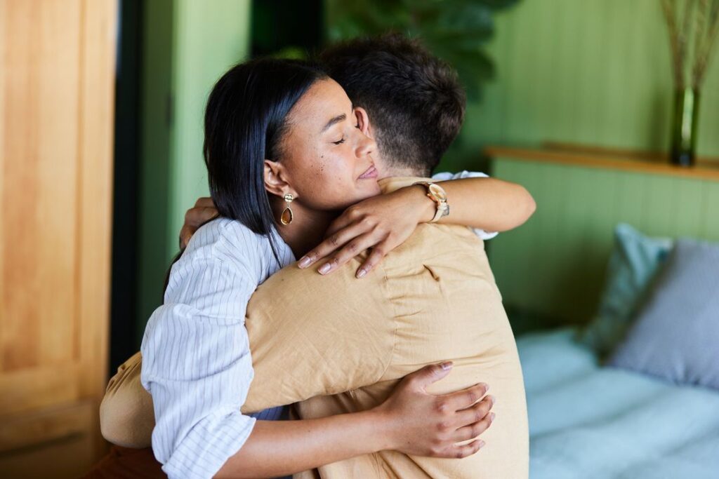 couple hugging eachother for support