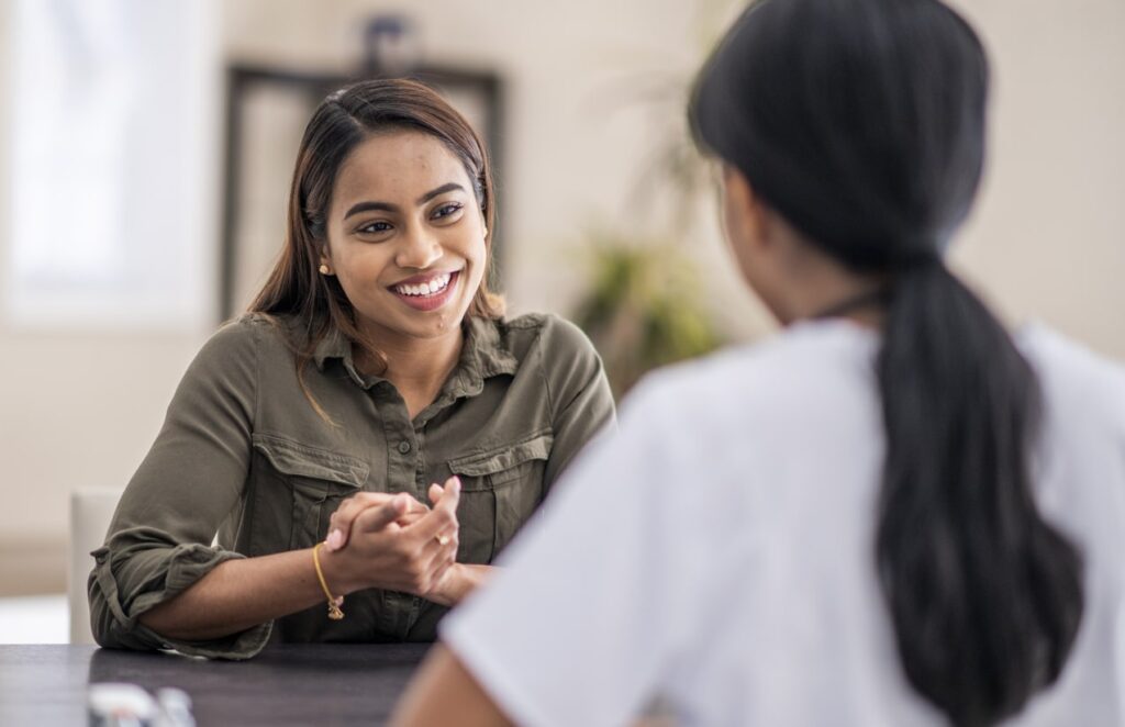 female patient talking with doctor