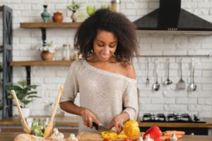 girl cooking breakfast making vegetable vegan salad