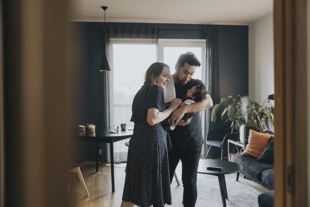 parents holding their child
