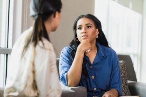 Two Women in Deep Conversation, Showing Empathy and Support